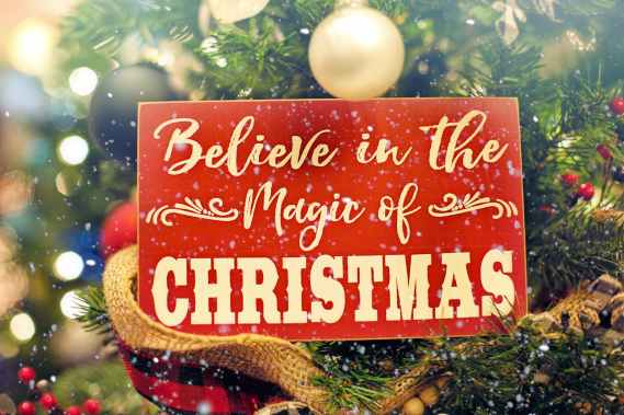 shallow focus photo of believe in the magic of christmas signage